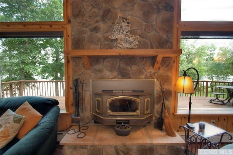 33 Golf Course Road Copake, NY 12521 - Photo 8 of 10 a living room with furniture and a floor to ceiling window