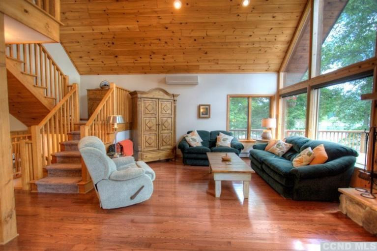 33 Golf Course Road Copake, NY 12521 - Photo 9 of 10 a living room with furniture and a large window