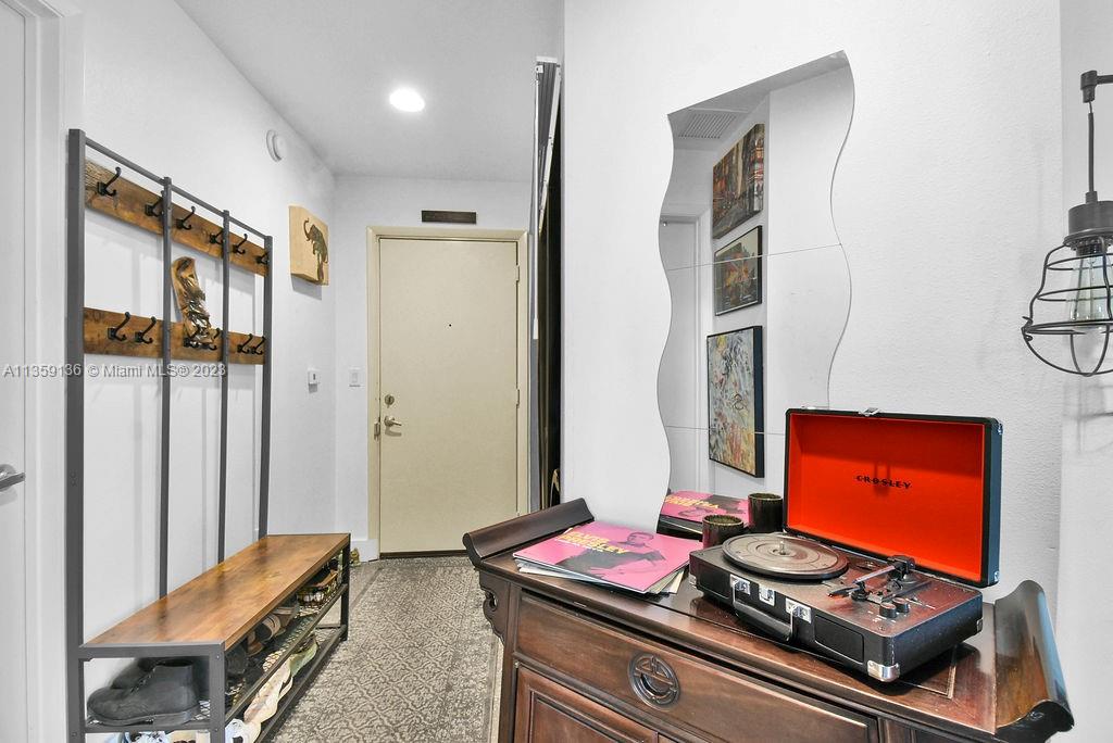 234 Northeast 3rd Street, Unit 507 Miami, FL 33132 - Photo 11 of 48 a room with furniture and gym equipment