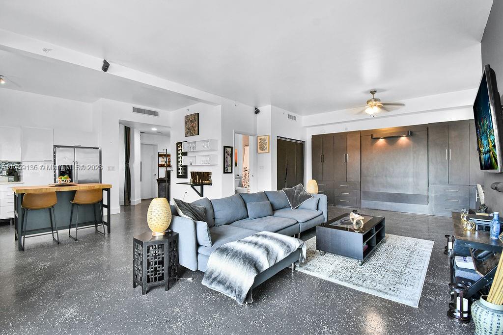 234 Northeast 3rd Street, Unit 507 Miami, FL 33132 - Photo 17 of 48 a living room with furniture and a table