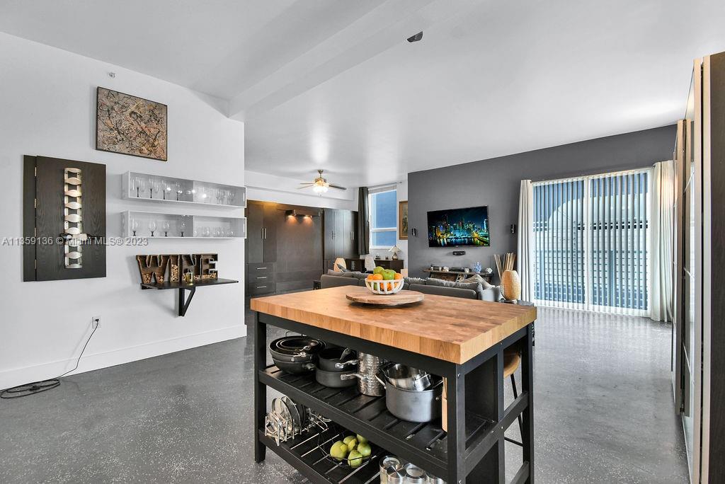234 Northeast 3rd Street, Unit 507 Miami, FL 33132 - Photo 21 of 48 a view of kitchen island kitchen island with furniture and refrigerator