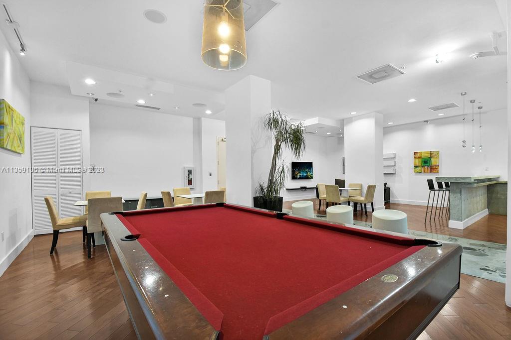 234 Northeast 3rd Street, Unit 507 Miami, FL 33132 - Photo 35 of 48 a room with furniture and pool table