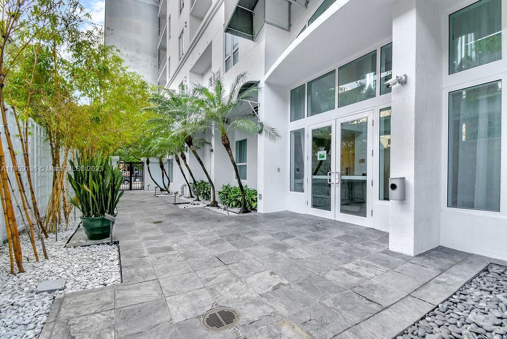 234 Northeast 3rd Street, Unit 507 Miami, FL 33132 - Photo 4 of 48 a view of a building with potted plants