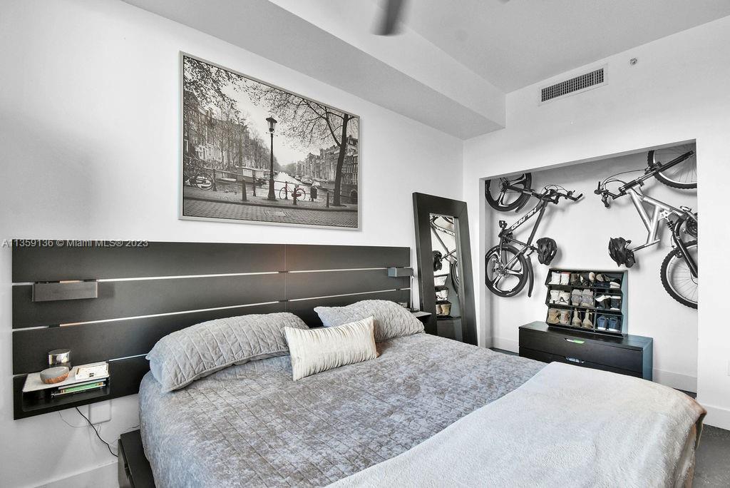 234 Northeast 3rd Street, Unit 507 Miami, FL 33132 - Photo 9 of 48 a bedroom with a bed and closet