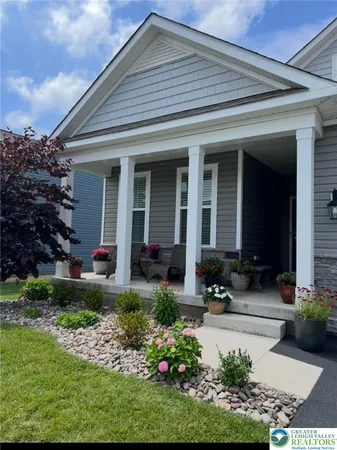 a front view of a house with a porch
