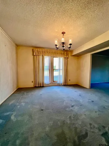 a view of a room with a chandelier