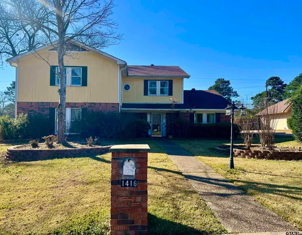 a front view of a house with swimming pool