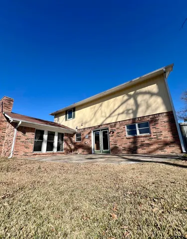 a view of a house with snow on the road
