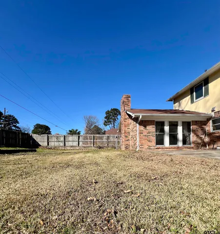 a view of a street with large trees