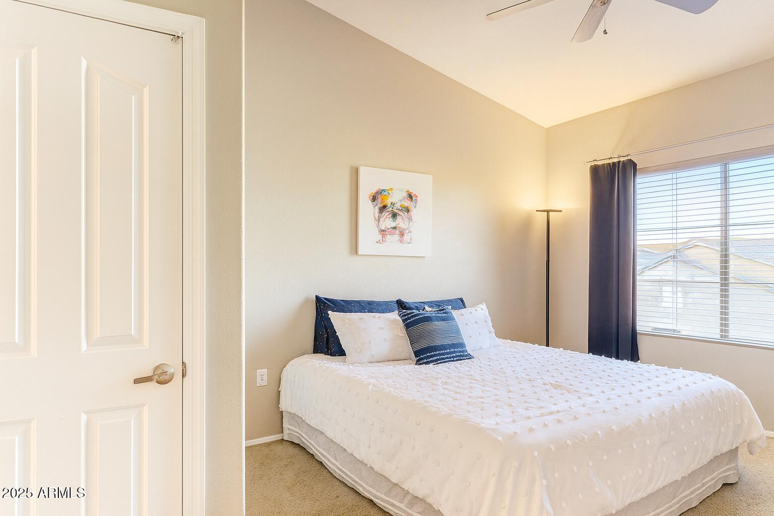 2150 West Alameda Road, Unit 1032 Phoenix, AZ 85085 - Photo 12 of 39 a bedroom with a bed and a window