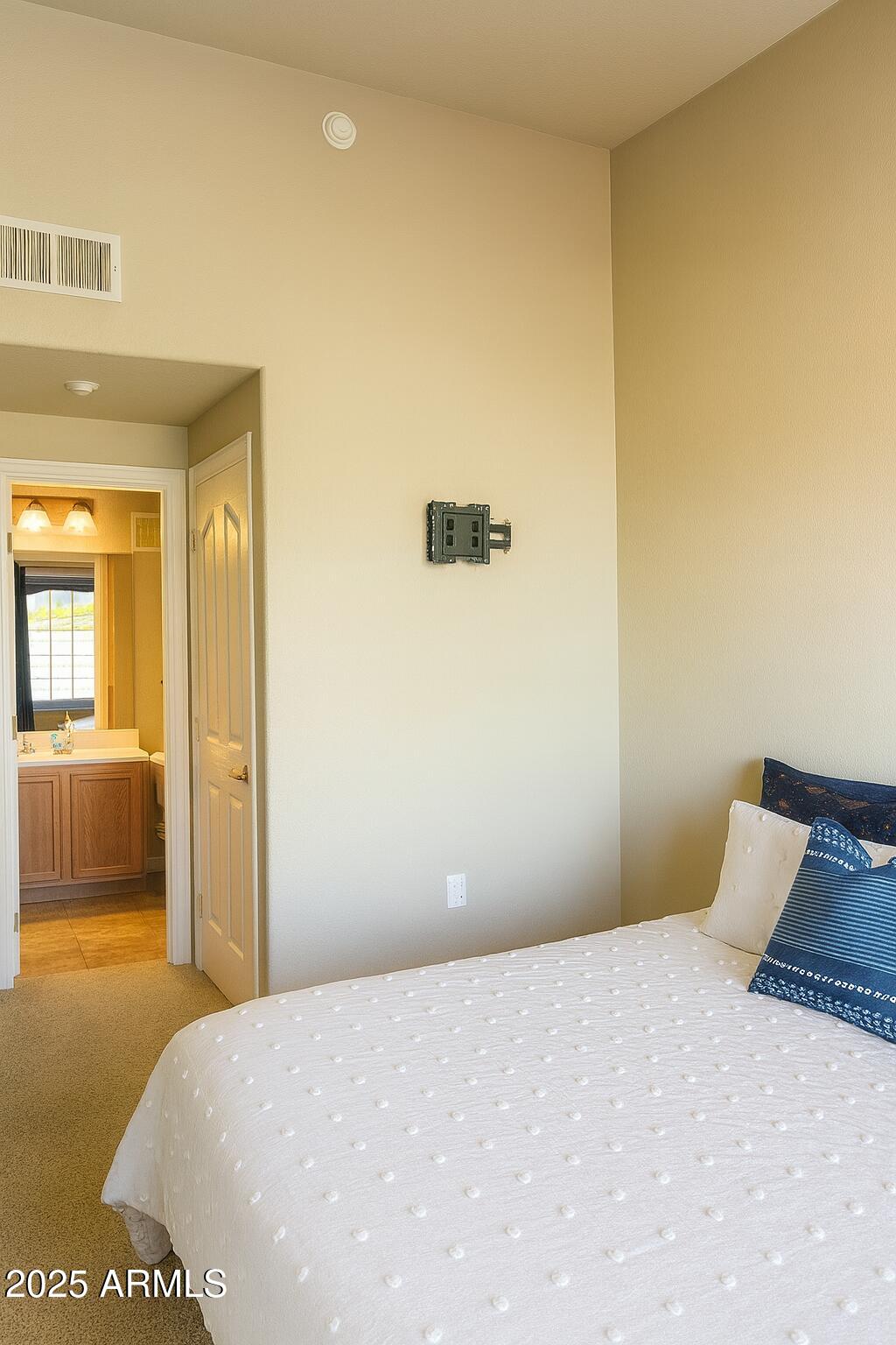 2150 West Alameda Road, Unit 1032 Phoenix, AZ 85085 - Photo 13 of 39 a bedroom with a bed and dresser