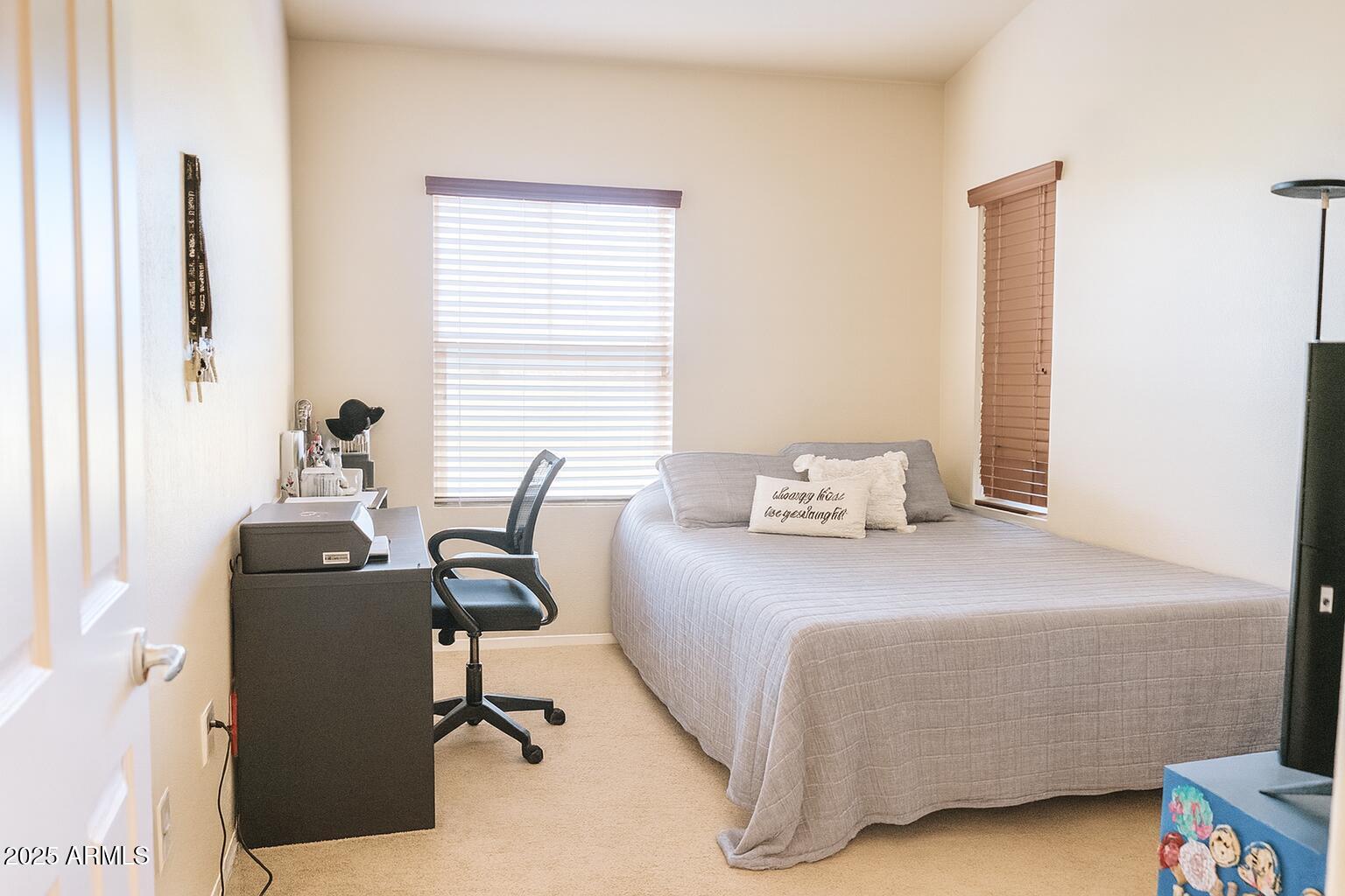 2150 West Alameda Road, Unit 1032 Phoenix, AZ 85085 - Photo 17 of 39 a bedroom with a bed and window