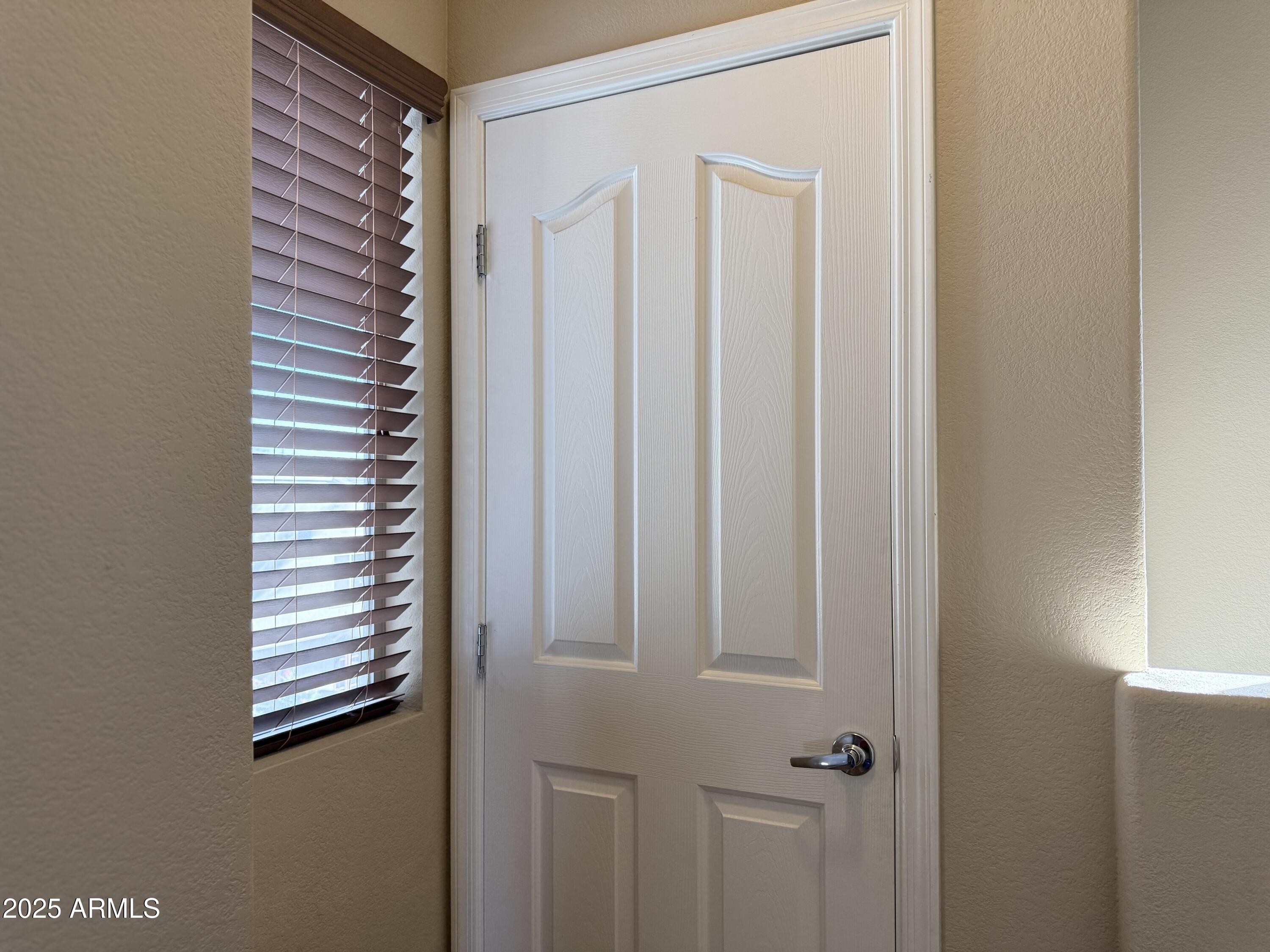 2150 West Alameda Road, Unit 1032 Phoenix, AZ 85085 - Photo 20 of 39 a view of a hallway with windows