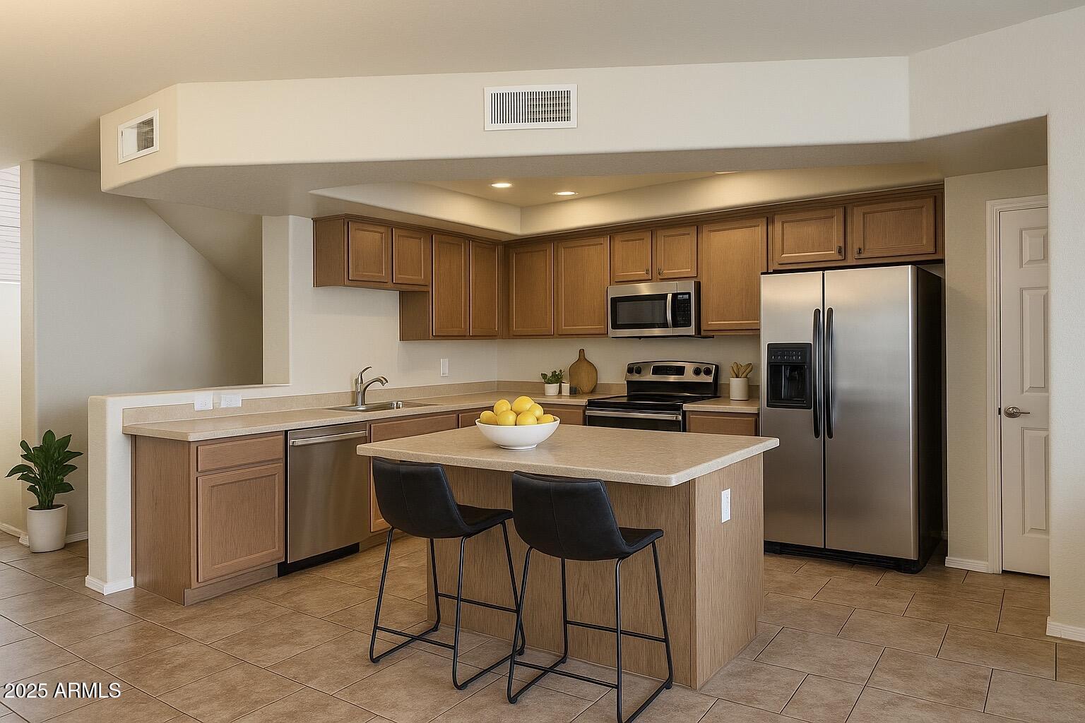 2150 West Alameda Road, Unit 1032 Phoenix, AZ 85085 - Photo 2 of 39 a kitchen with kitchen island a sink counter top space cabinets and stainless steel appliances