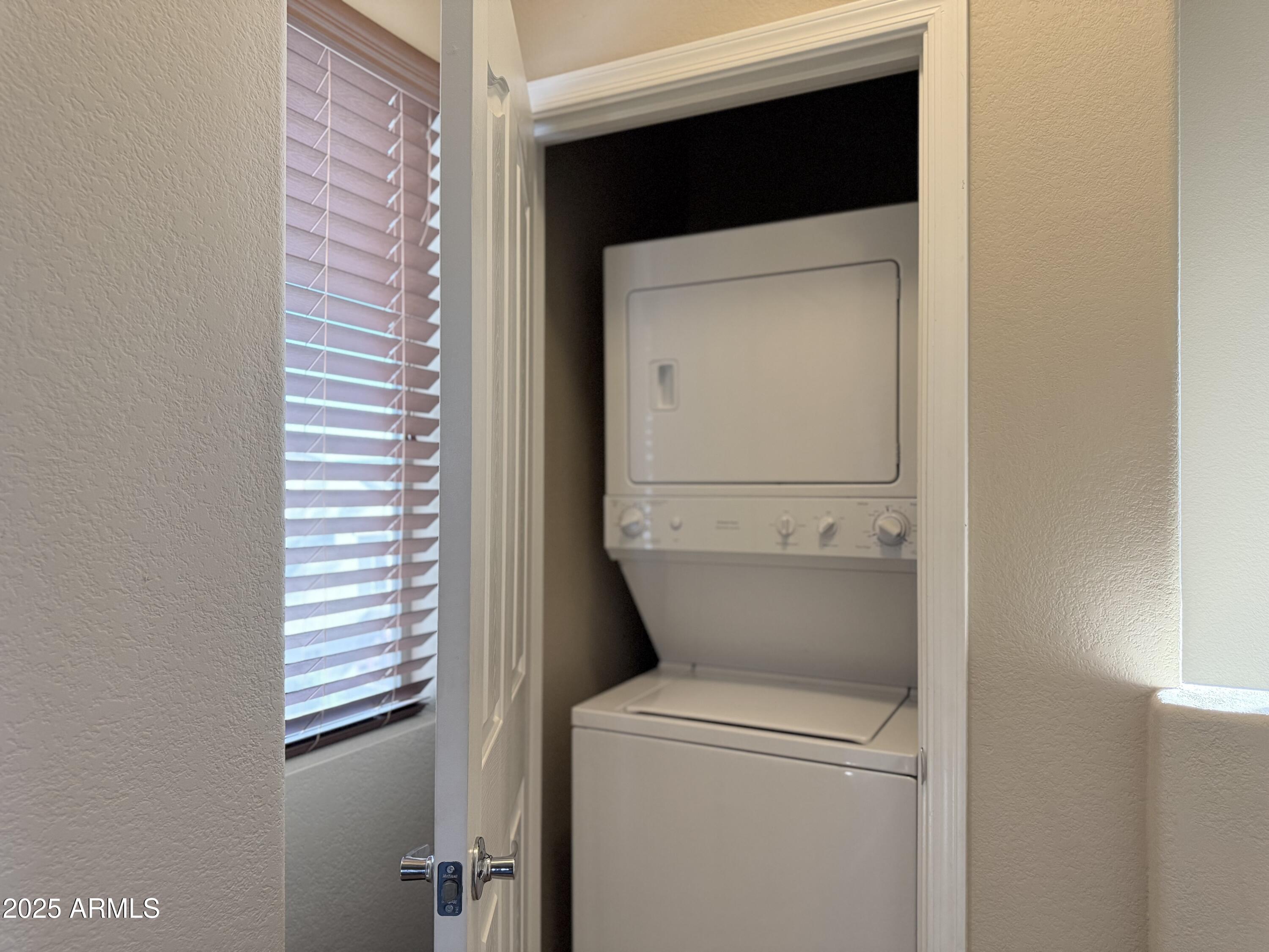 2150 West Alameda Road, Unit 1032 Phoenix, AZ 85085 - Photo 21 of 39 a utility room with a washer and dryer