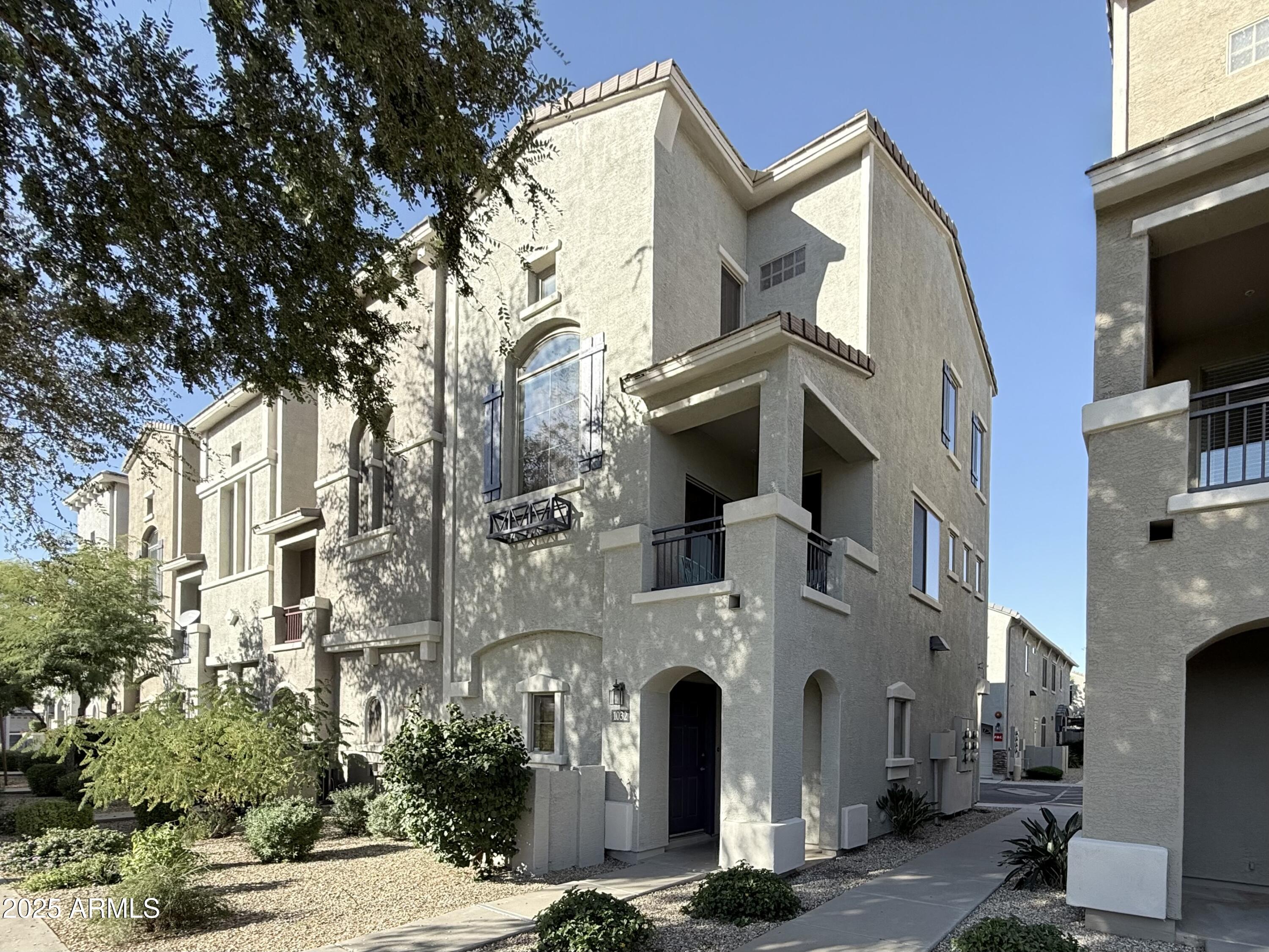 2150 West Alameda Road, Unit 1032 Phoenix, AZ 85085 - Photo 22 of 39 a view of a white apartments with large tree