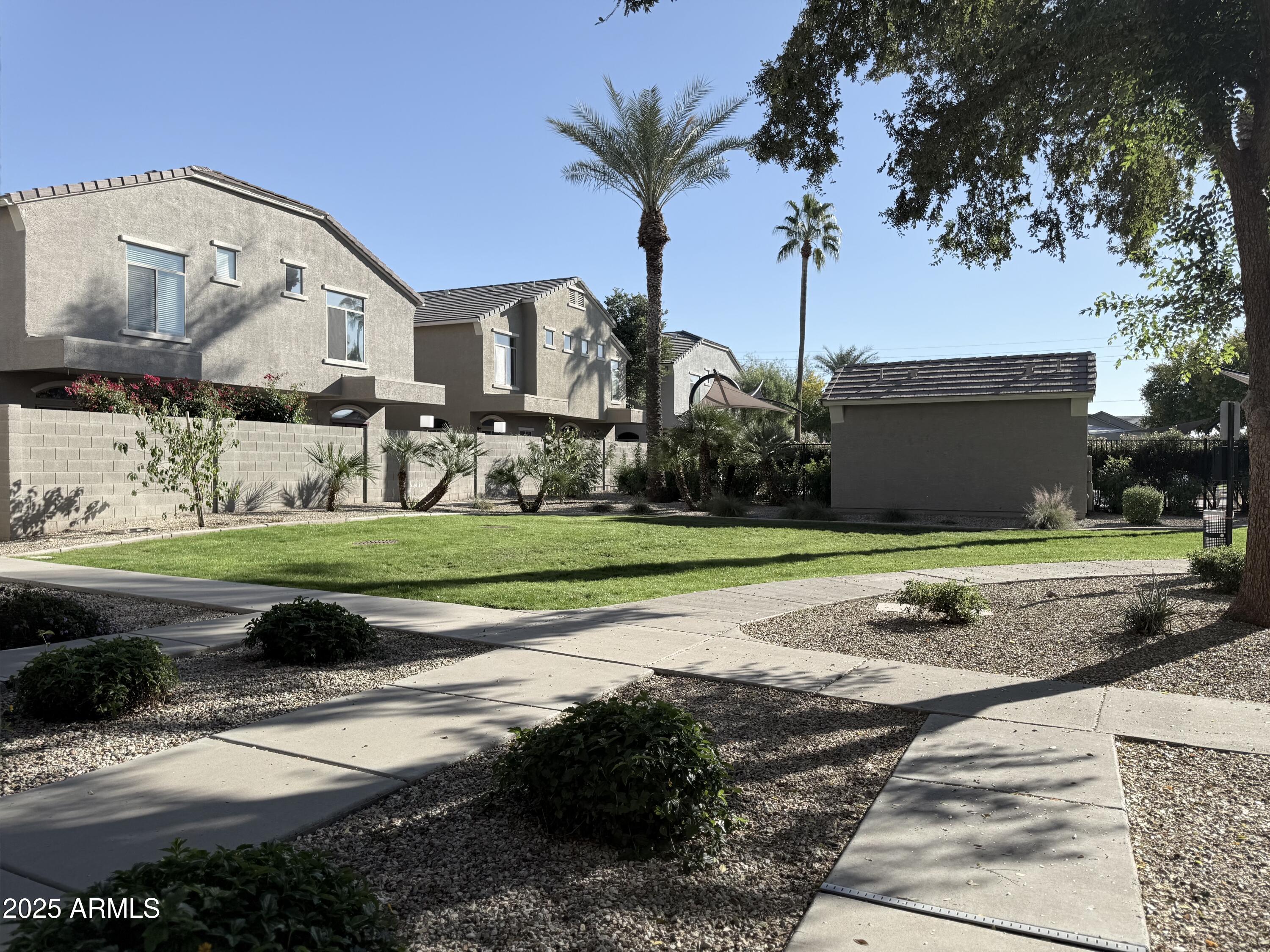 2150 West Alameda Road, Unit 1032 Phoenix, AZ 85085 - Photo 24 of 39 a view of a garden with palm trees