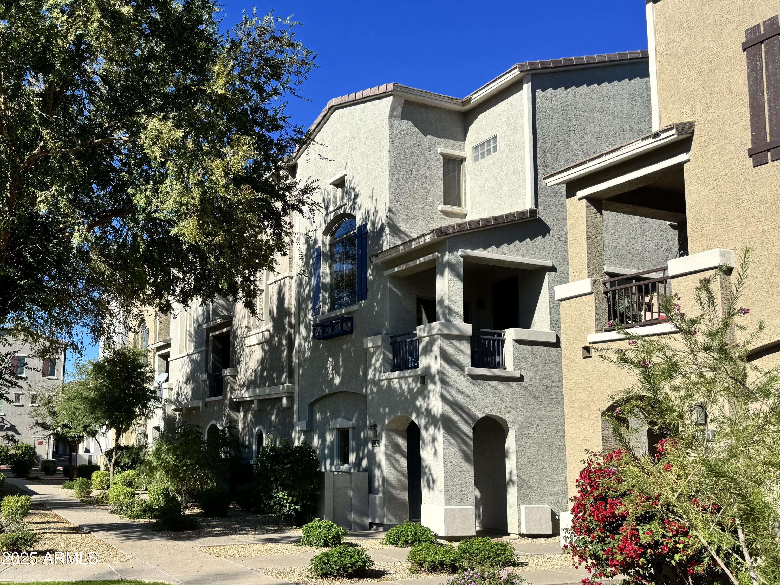 2150 West Alameda Road, Unit 1032 Phoenix, AZ 85085 - Photo 26 of 39 front view of a house with a street