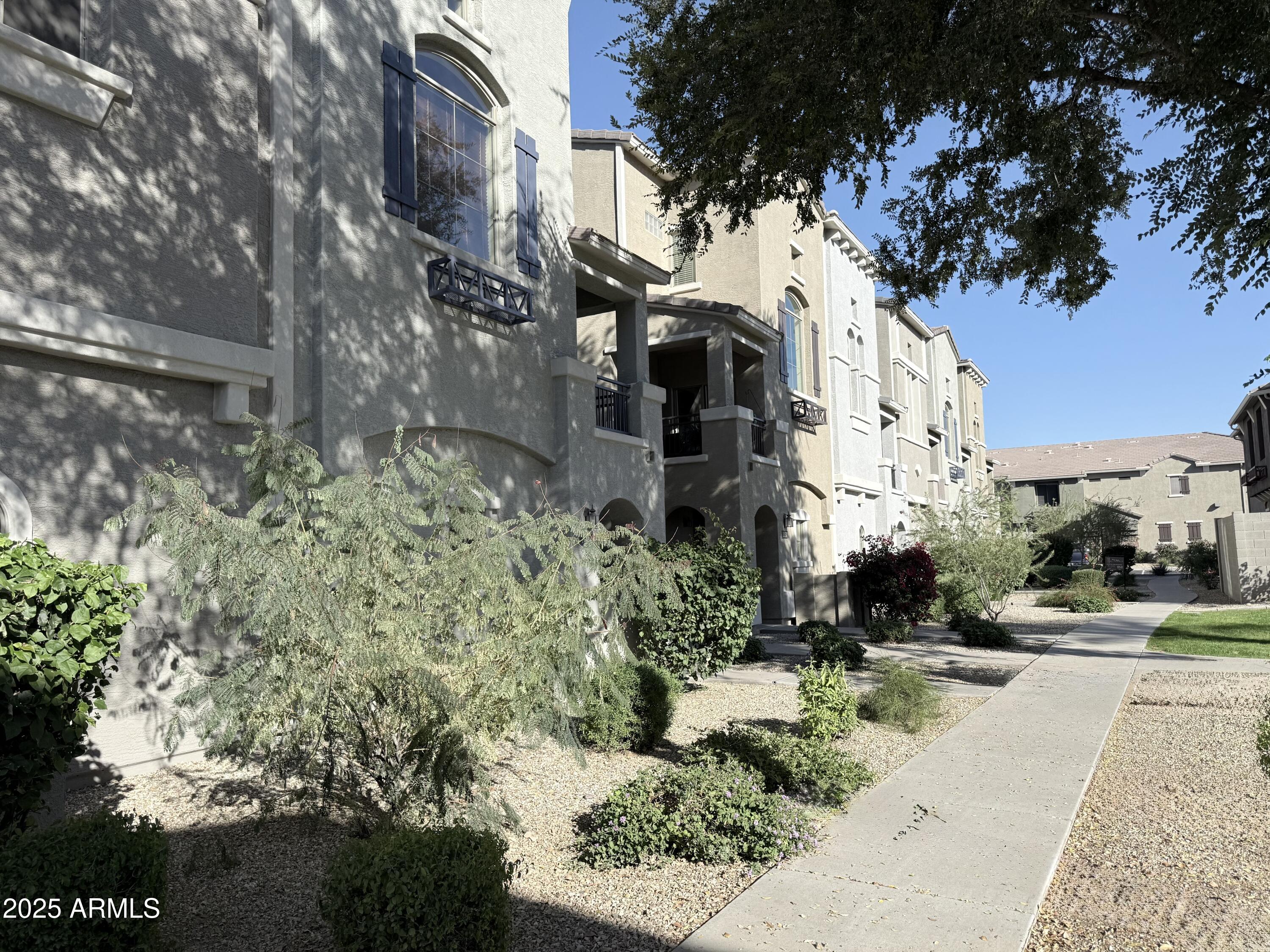 2150 West Alameda Road, Unit 1032 Phoenix, AZ 85085 - Photo 27 of 39 a view of a street with houses