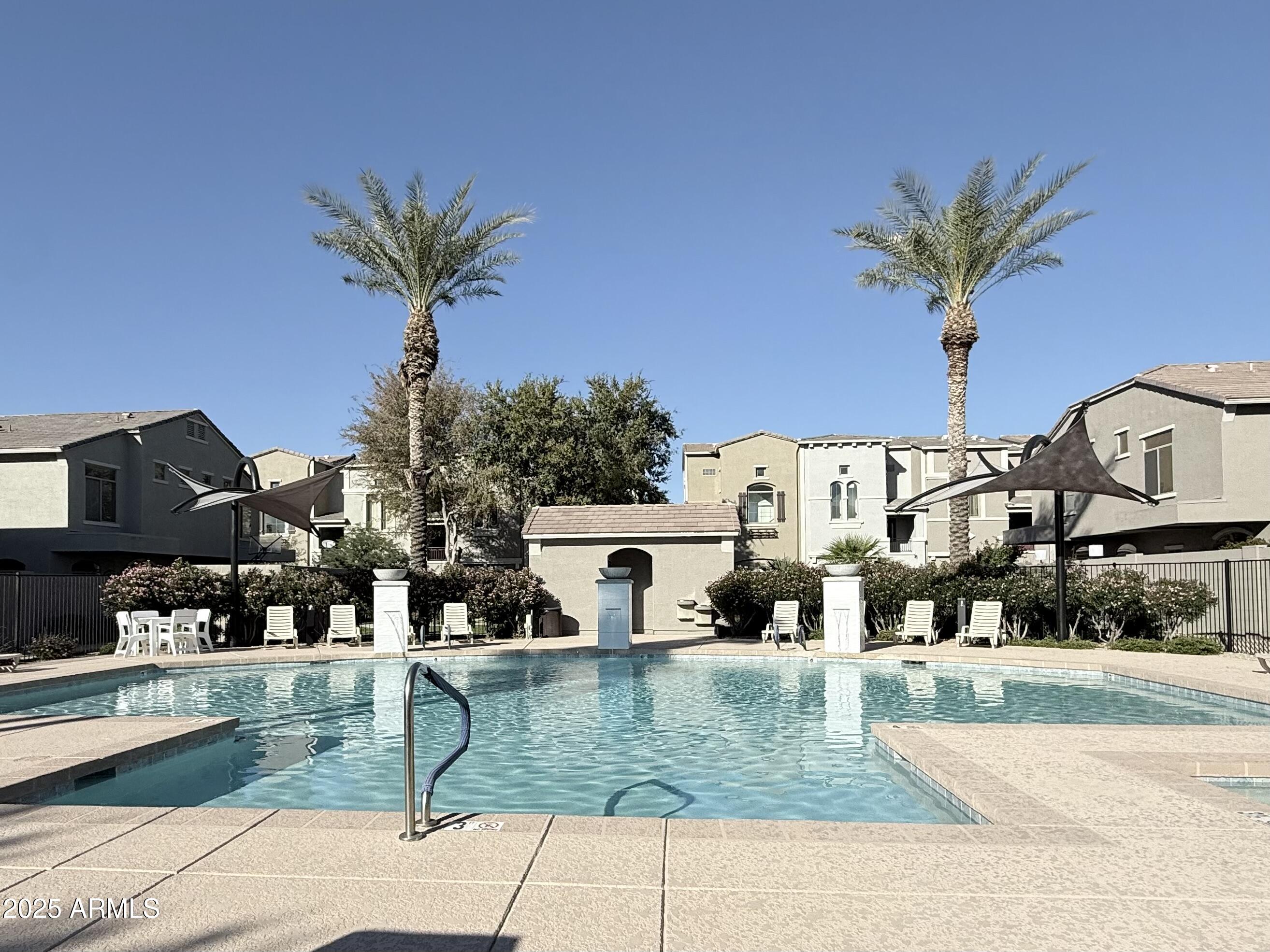 2150 West Alameda Road, Unit 1032 Phoenix, AZ 85085 - Photo 29 of 39 a view of a house with a yard