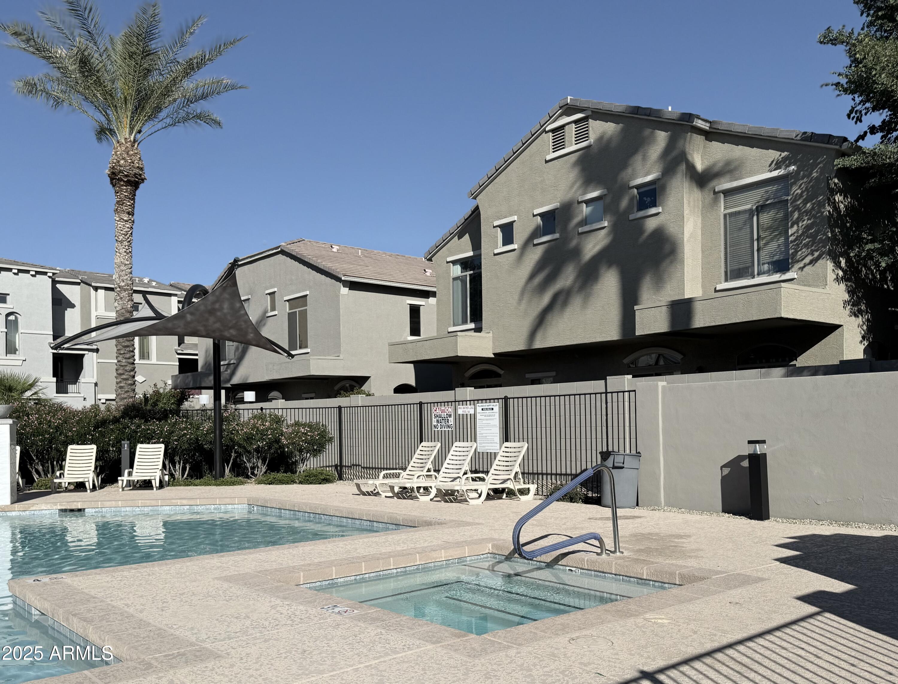 2150 West Alameda Road, Unit 1032 Phoenix, AZ 85085 - Photo 30 of 39 a front view of a house with garden