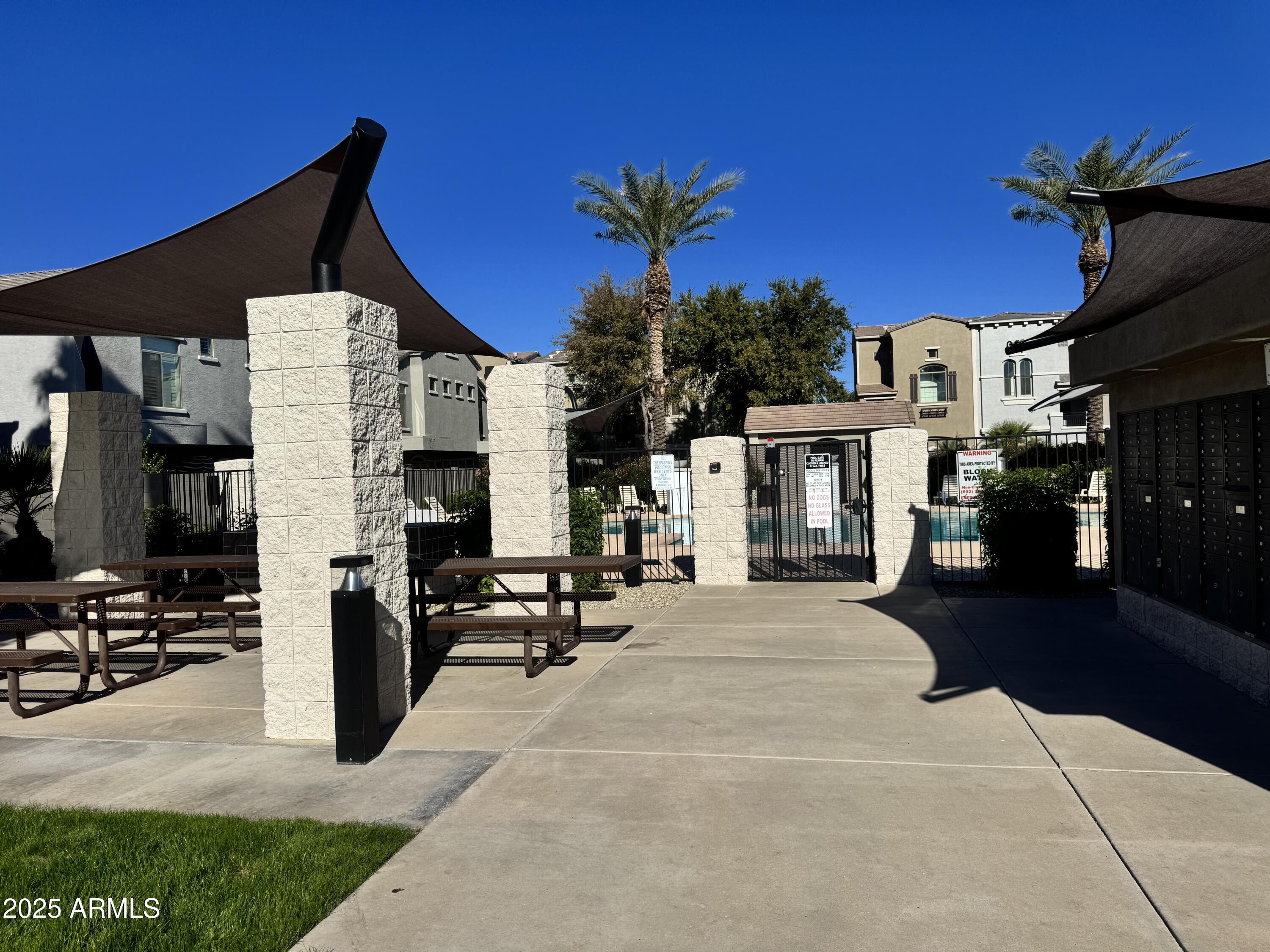 2150 West Alameda Road, Unit 1032 Phoenix, AZ 85085 - Photo 34 of 39 a view of house with outdoor space and sitting area