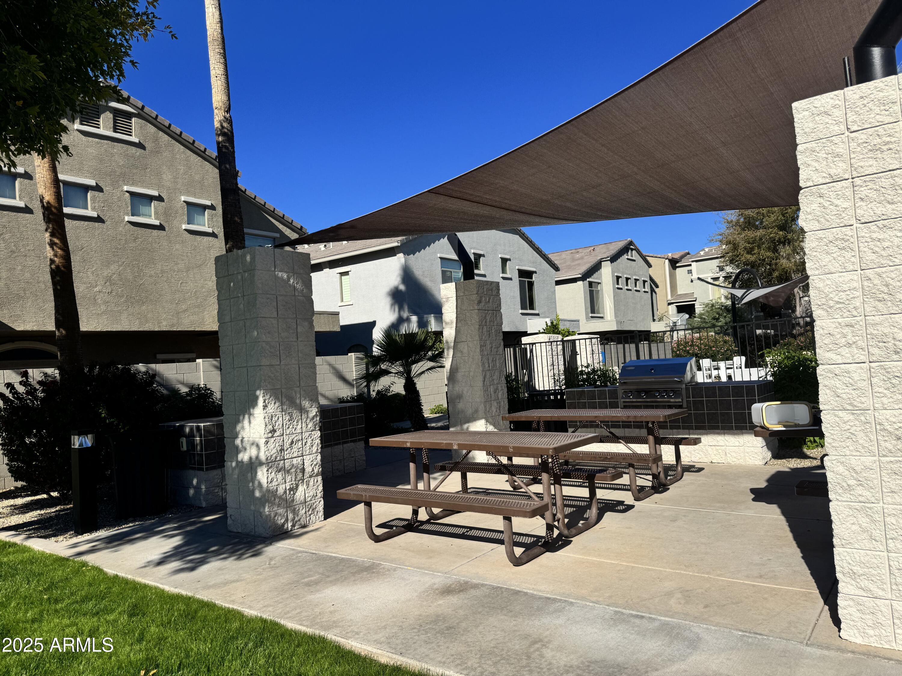 2150 West Alameda Road, Unit 1032 Phoenix, AZ 85085 - Photo 35 of 39 a view of a chairs and tables in the patio