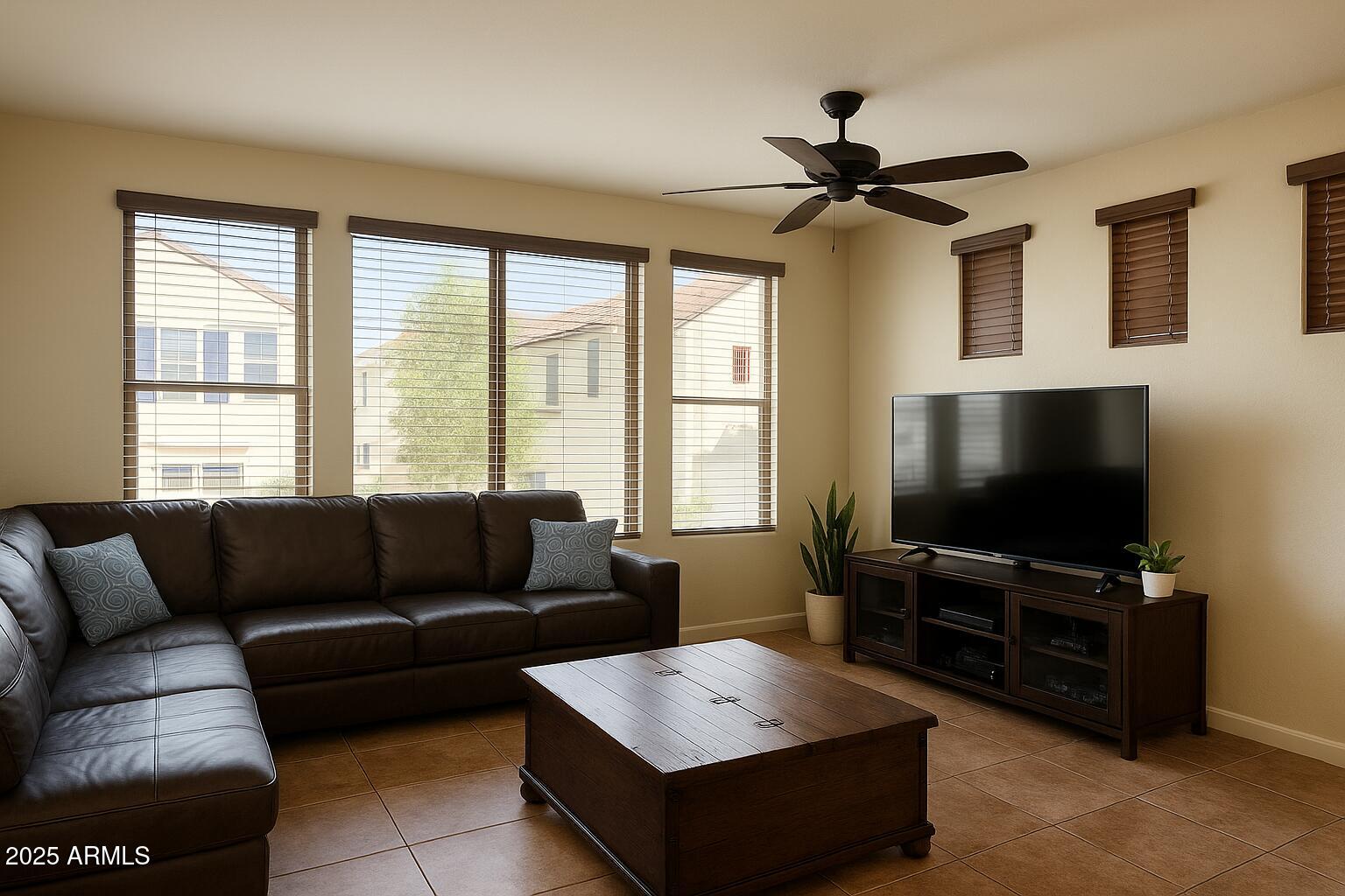 2150 West Alameda Road, Unit 1032 Phoenix, AZ 85085 - Photo 5 of 39 a living room with furniture and a flat screen tv