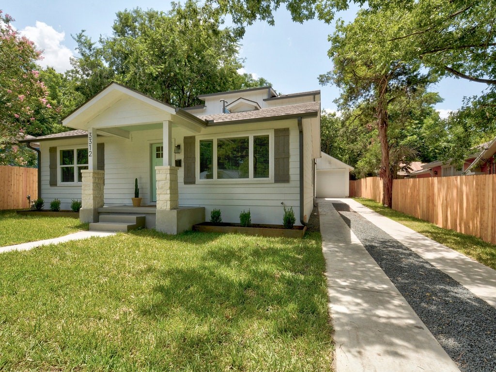 3312 Cherrywood Road Austin, TX 78722 - Photo 1 of 1 a front view of a house with a yard