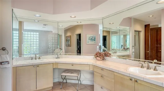 a bathroom with a sink double vanity and a mirror