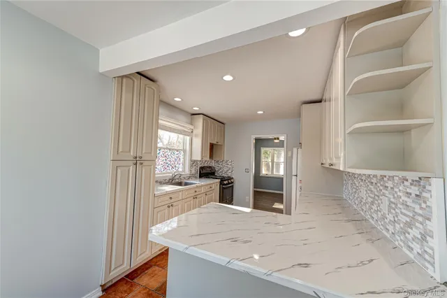 a view of a kitchen cabinets and a counter place