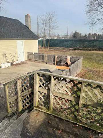 a view of a terrace with wooden floor and lake view