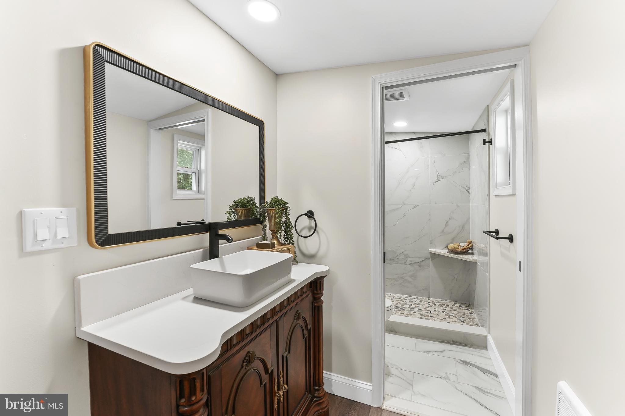 250 Red Pump Road Nottingham, PA 19362 - Photo 17 of 29 a bathroom with a sink and a mirror