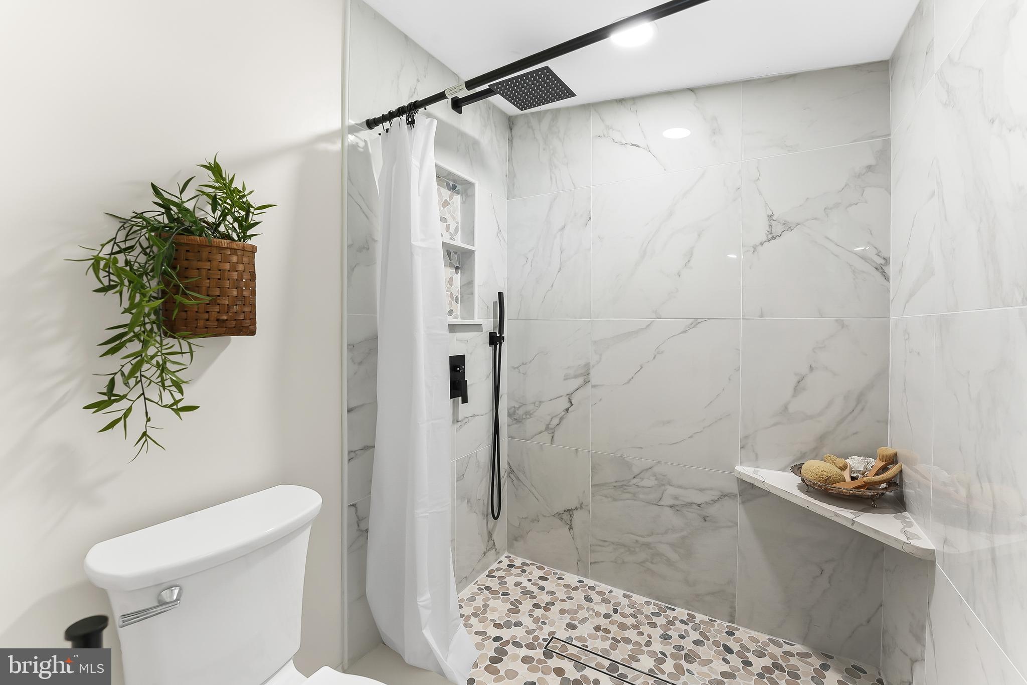 250 Red Pump Road Nottingham, PA 19362 - Photo 18 of 29 a bathroom with a shower and a toilet