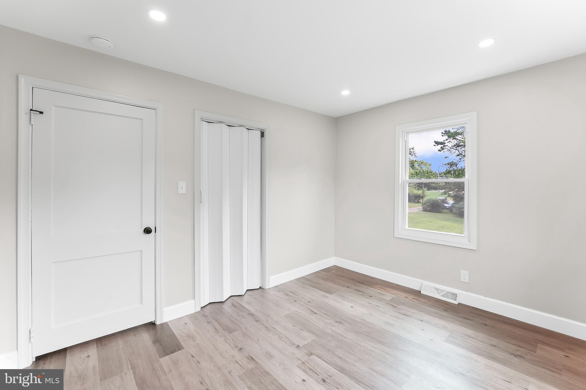 250 Red Pump Road Nottingham, PA 19362 - Photo 20 of 29 an empty room with wooden floor and window