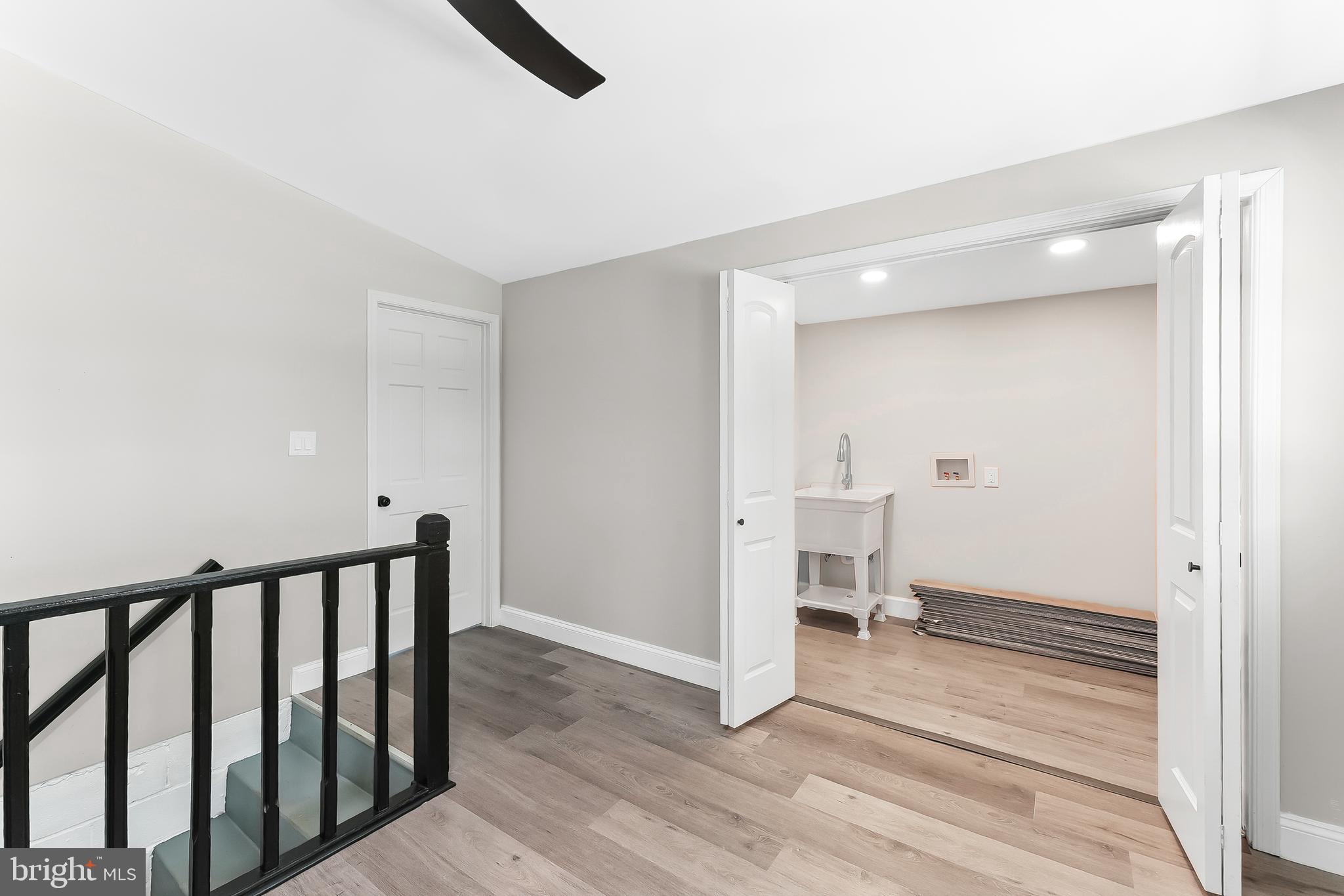 250 Red Pump Road Nottingham, PA 19362 - Photo 26 of 29 a view of a hallway with wooden floor and a living room