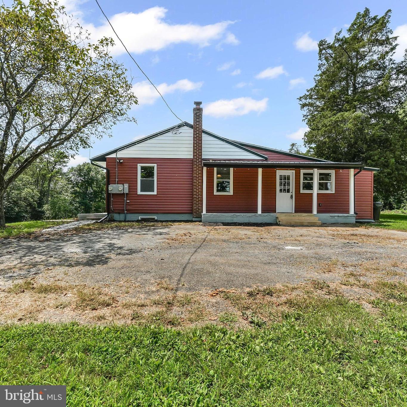 250 Red Pump Road Nottingham, PA 19362 - Photo 4 of 29 a front view of house with yard and trees around
