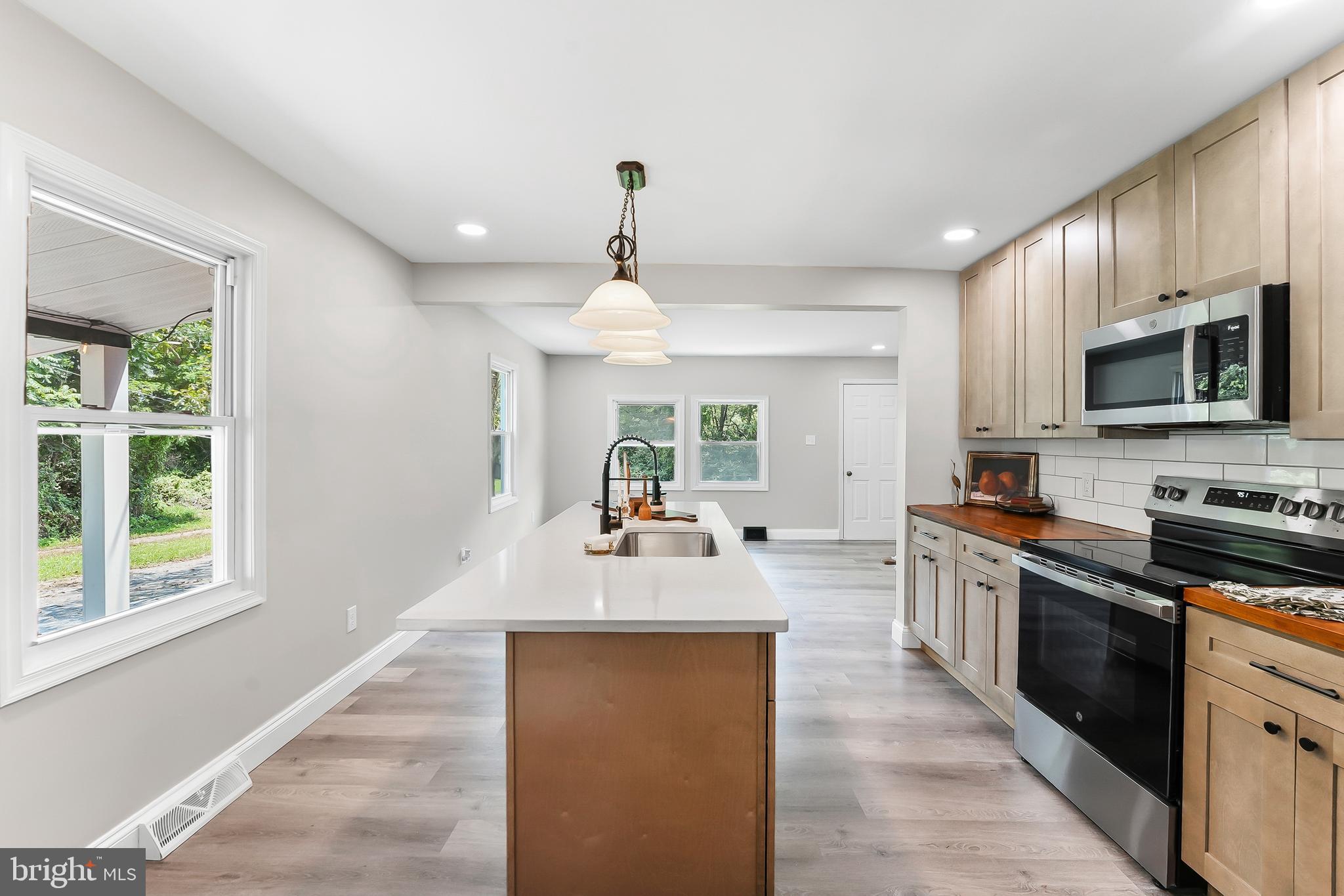 250 Red Pump Road Nottingham, PA 19362 - Photo 5 of 29 a large kitchen with granite countertop a large counter top space appliances and cabinets
