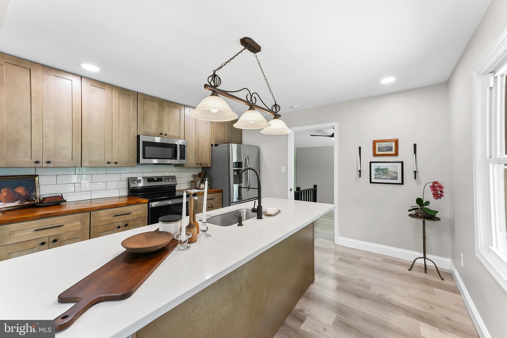 250 Red Pump Road Nottingham, PA 19362 - Photo 7 of 29 a kitchen with a sink stove and microwave
