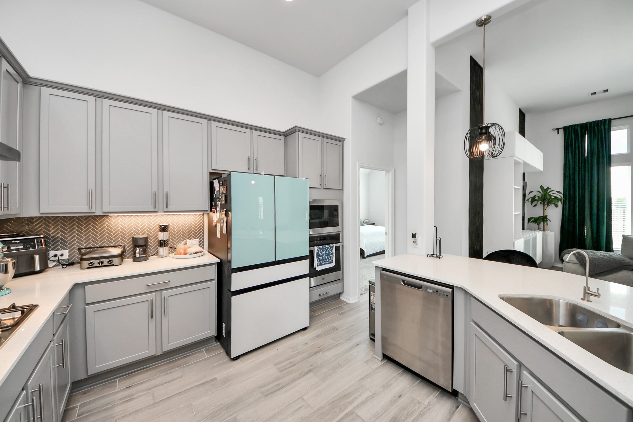 1614 Sequoia Run Drive Rosharon, TX 77583 - Photo 18 of 45 a kitchen with a sink a refrigerator and cabinets