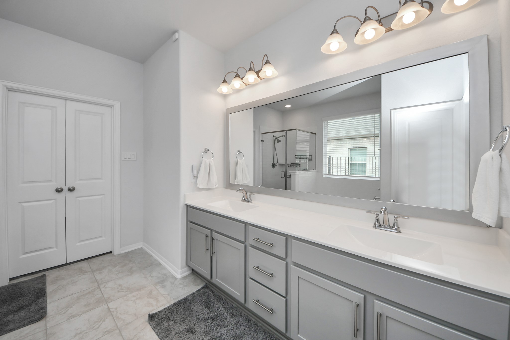 1614 Sequoia Run Drive Rosharon, TX 77583 - Photo 27 of 45 a bathroom with double vanity sinks and a mirror