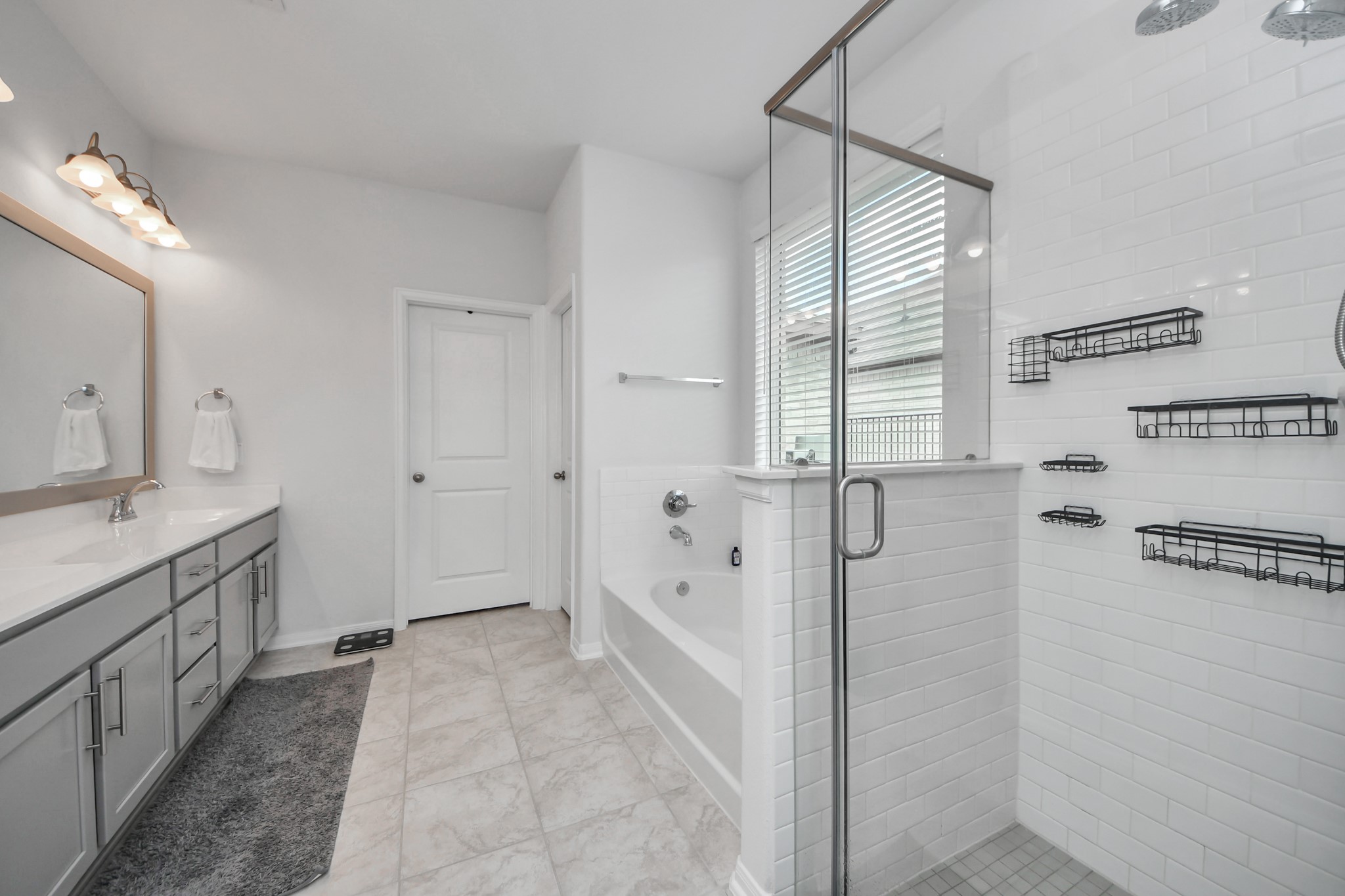 1614 Sequoia Run Drive Rosharon, TX 77583 - Photo 29 of 45 a bathroom with a granite countertop sink a mirror and a bathtub