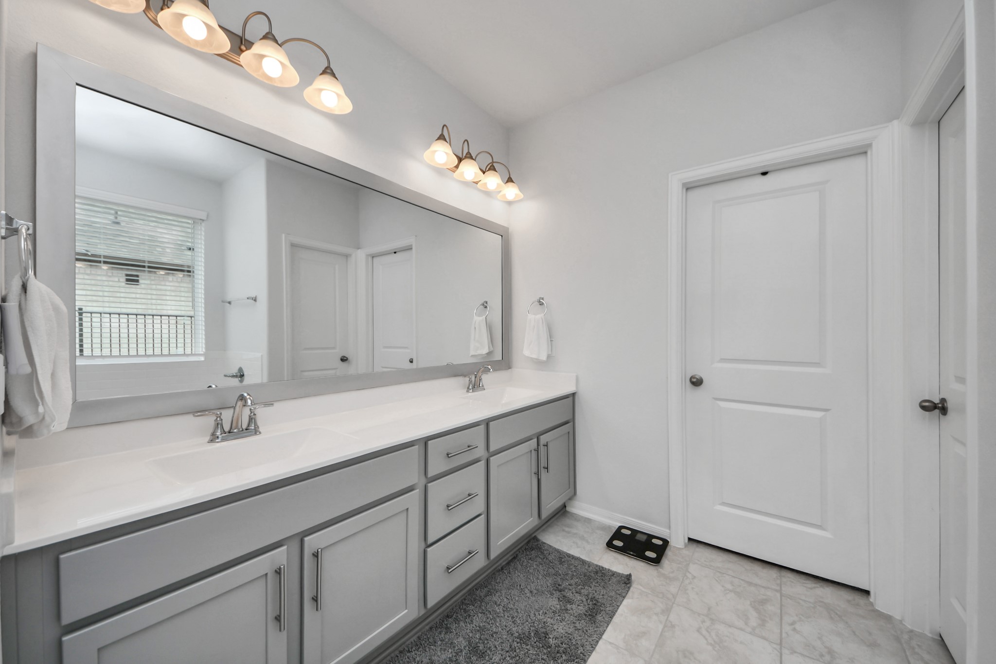 1614 Sequoia Run Drive Rosharon, TX 77583 - Photo 30 of 45 a bathroom with a double vanity sink and a mirror