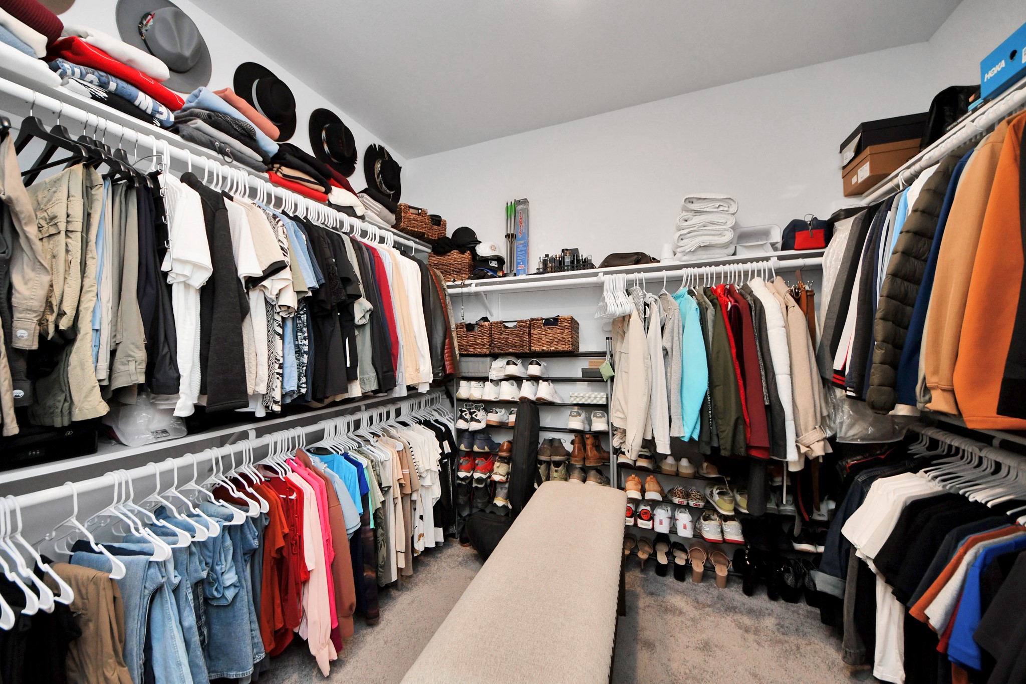 1614 Sequoia Run Drive Rosharon, TX 77583 - Photo 32 of 45 a view of walk in closet with clothes and shoes