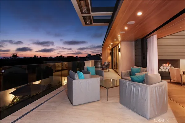 a view of a couches and dinning table in patio