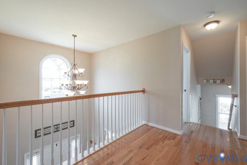 11625 Explorer Drive Midlothian, VA 23114 - Photo 4 of 56 Upper level hall with foyer chandelier & Hardwood