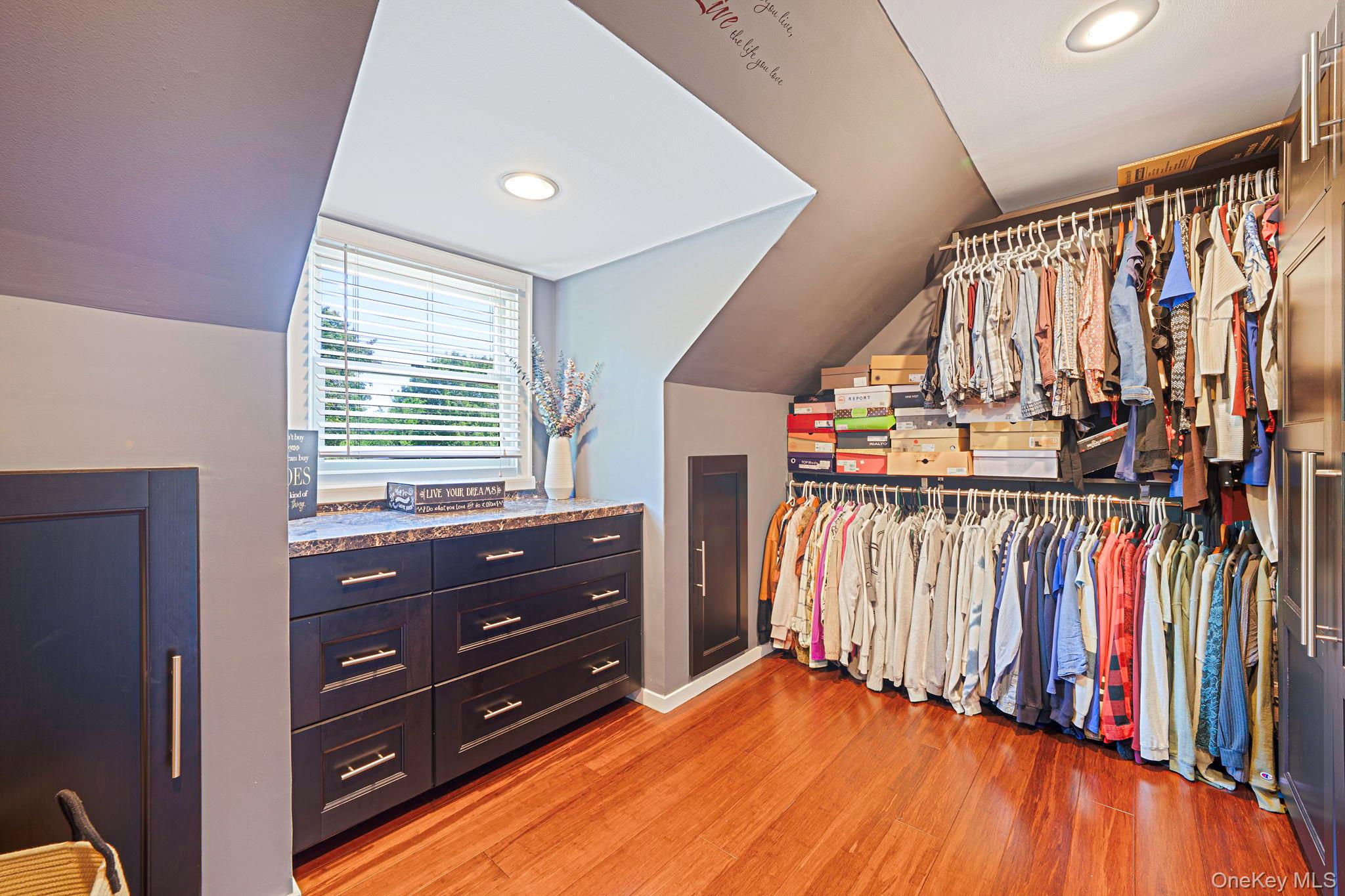 183 Old Country Road Speonk, NY 11972 - Photo 12 of 48 Walk in closet with light wood-style floors and lofted ceiling