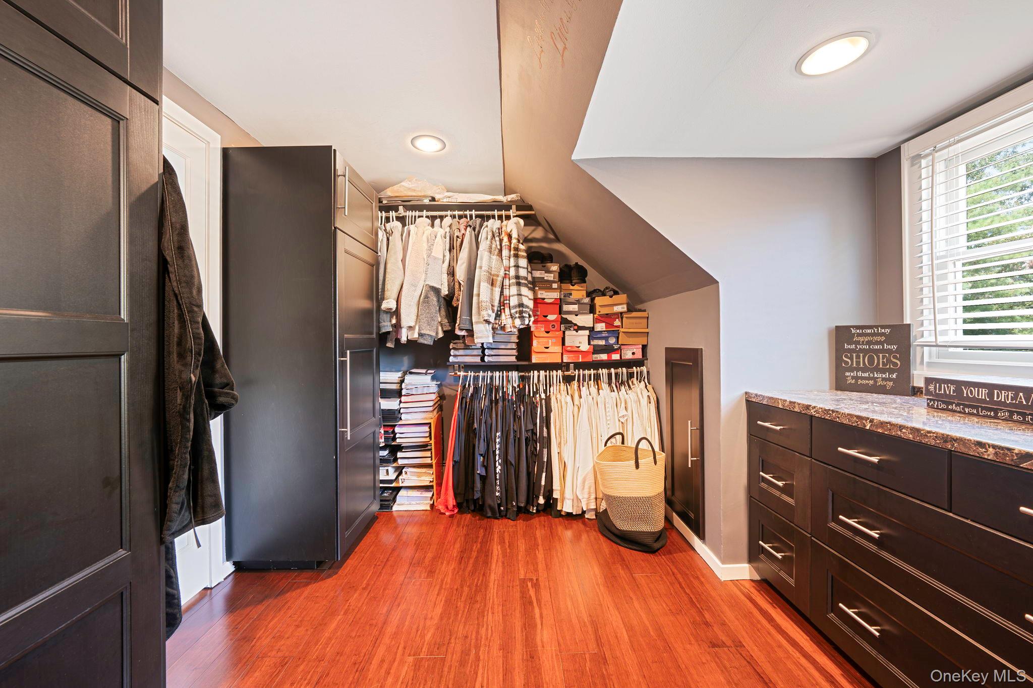 183 Old Country Road Speonk, NY 11972 - Photo 13 of 48 Walk in closet with dark wood-style flooring