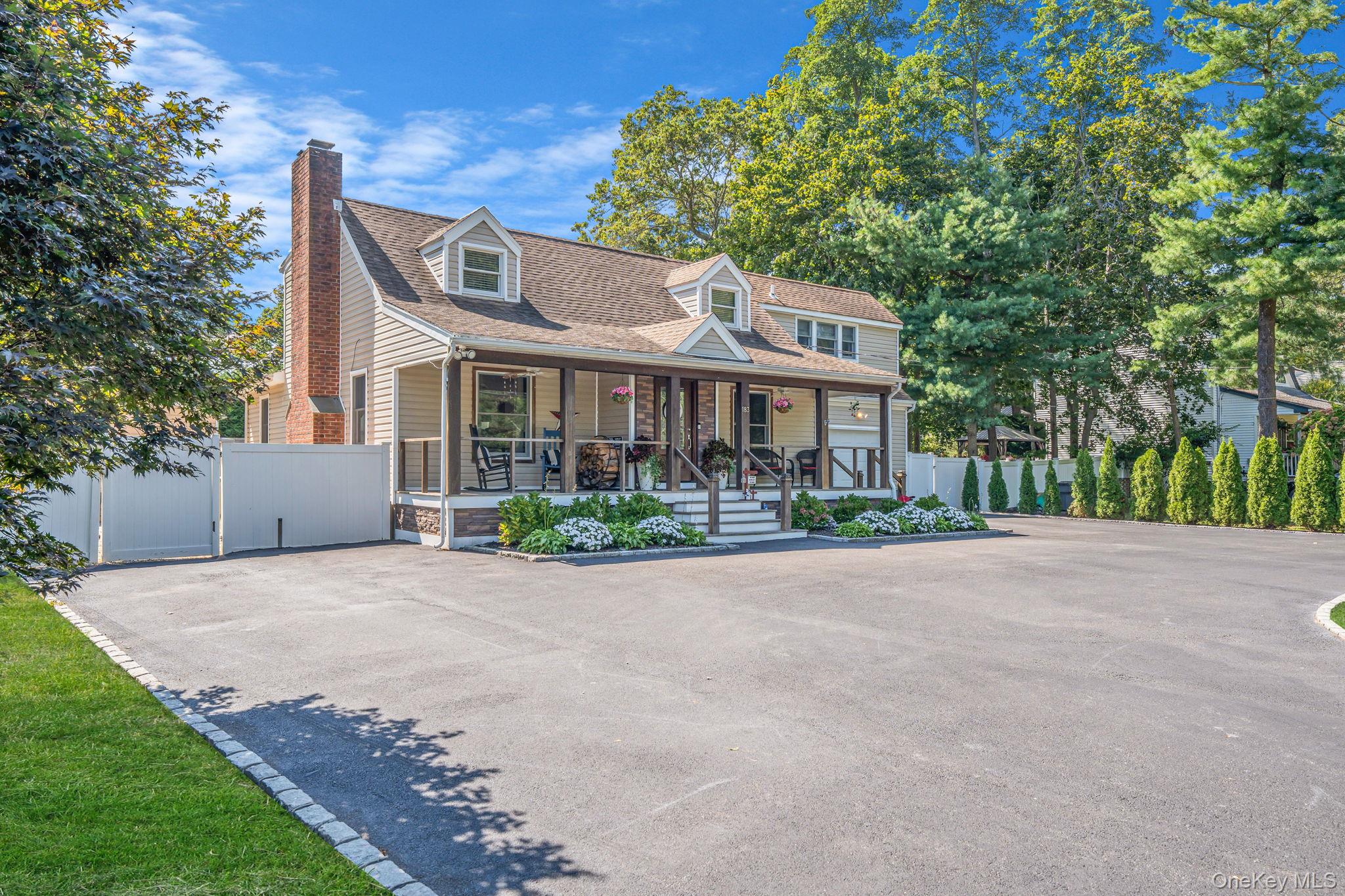183 Old Country Road Speonk, NY 11972 - Photo 2 of 48 Cape cod house with covered porch, a chimney, a shingled roof, and a gate