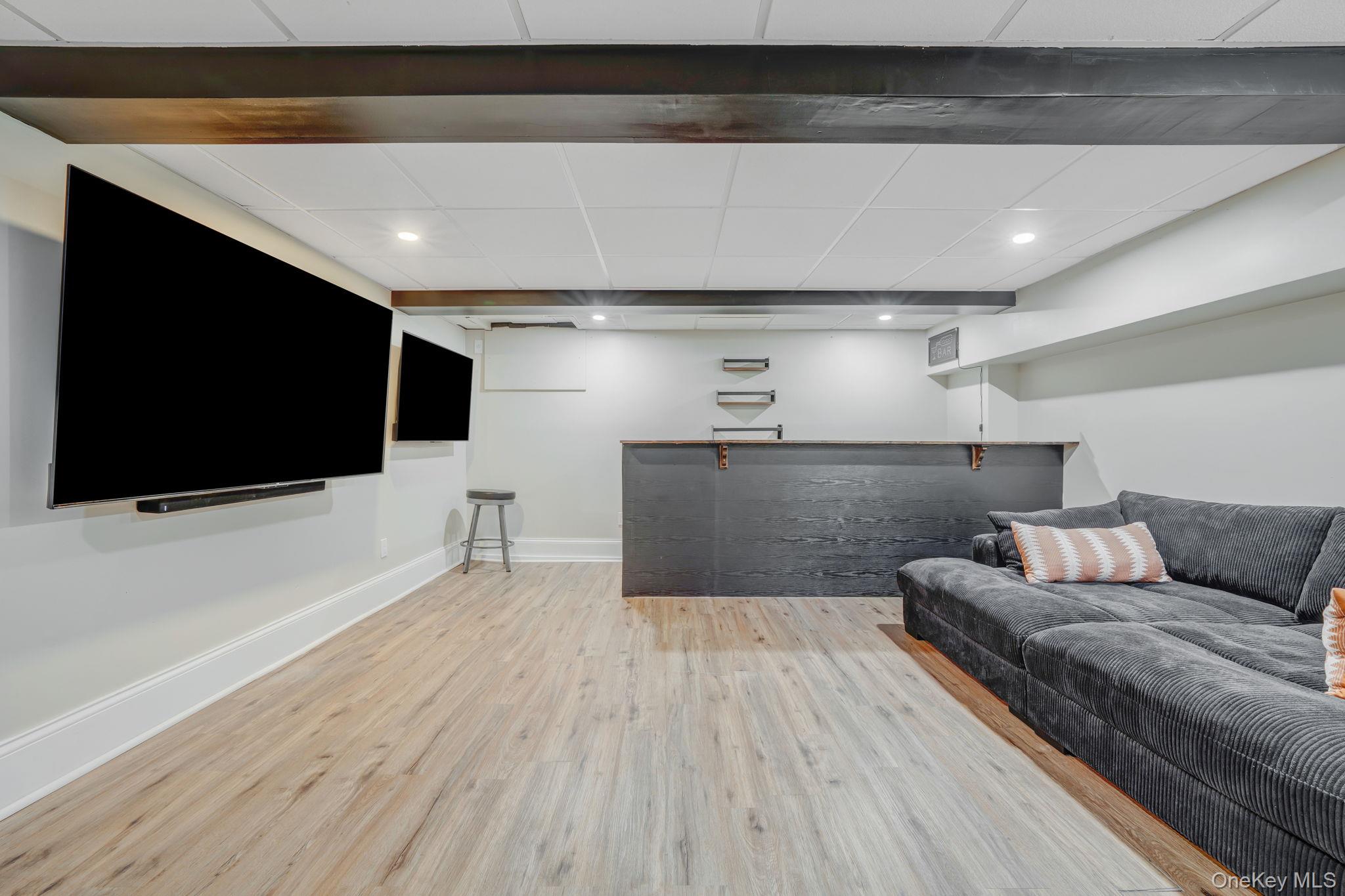 183 Old Country Road Speonk, NY 11972 - Photo 34 of 48 Living area featuring a drop ceiling, light wood-style flooring, and recessed lighting